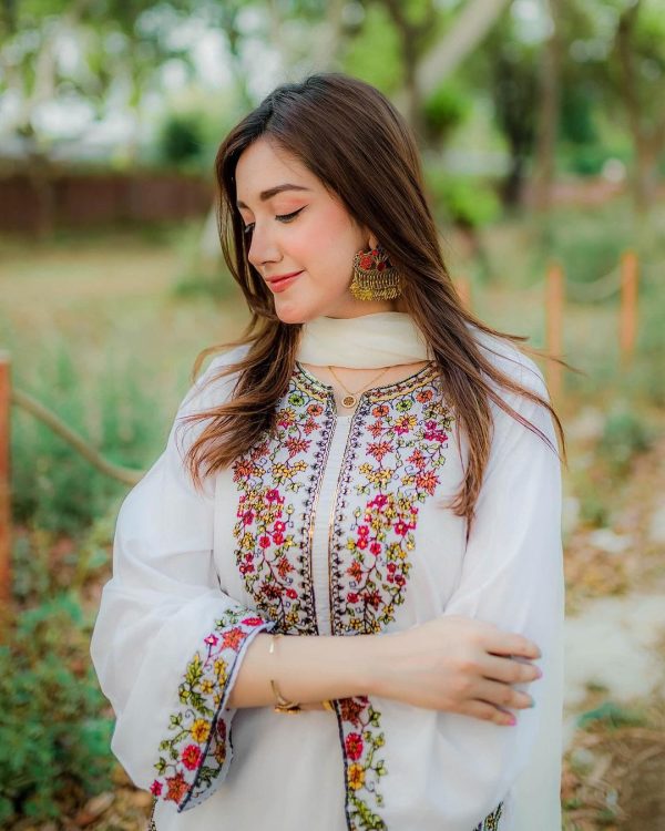 Sophisticated White 2PC Stitched Suit with Elegant Pocket Sequence Embroidery for Timeless Occasions - Open Market Pakistan