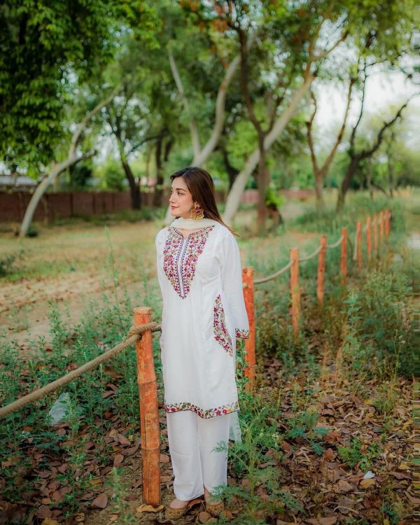 Sophisticated White 2PC Stitched Suit with Elegant Pocket Sequence Embroidery for Timeless Occasions - Open Market Pakistan